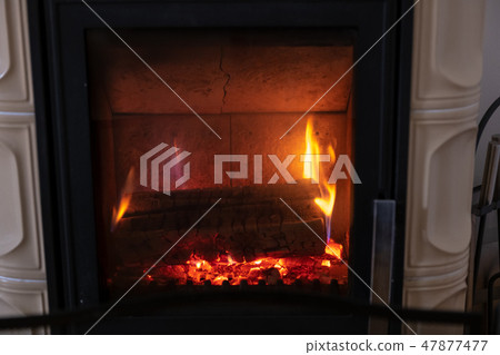 Fire in stove, close up, firewood burning Fire in stove, close up, firewood burning 47877477