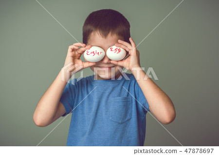 The child closes his eyes Easter eggs 47878697