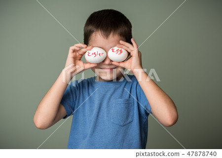 A little boy holding a Easter eggs A little boy holding a Easter eggs 47878740