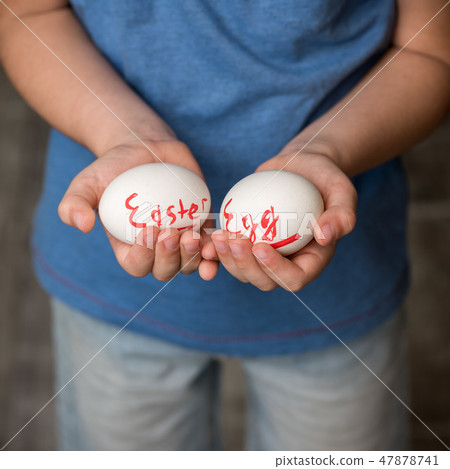 A little boy holding a Easter eggs A little boy holding a Easter eggs 47878741