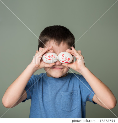 A little boy holding a Easter eggs A little boy holding a Easter eggs 47878754