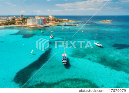 Boats and luxury yachts in transparent sea  47879079