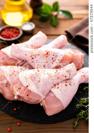 Raw fresh chicken legs on wooden background Raw fresh chicken legs on wooden background 47879844