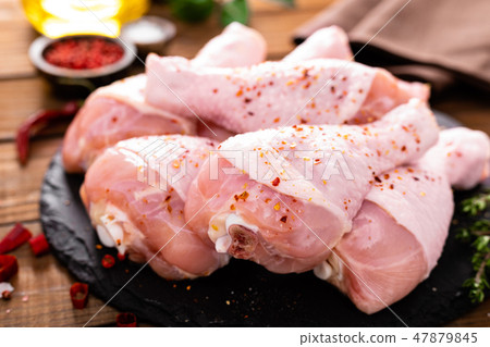 Raw fresh chicken legs on wooden background Raw fresh chicken legs on wooden background 47879845