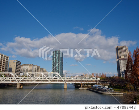 Rapid train crossing the Yodogawa Bridge on the Osaka Cyclic Line 47882448