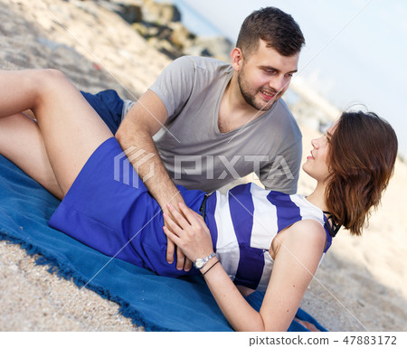 Positive loving couple resting and hugging Positive loving couple resting and hugging 47883172