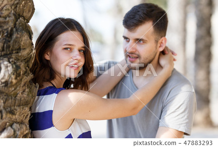 Man and girl talking and hugging Man and girl talking and hugging 47883293