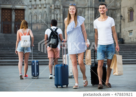 ouple walking through ancient European city 47883921