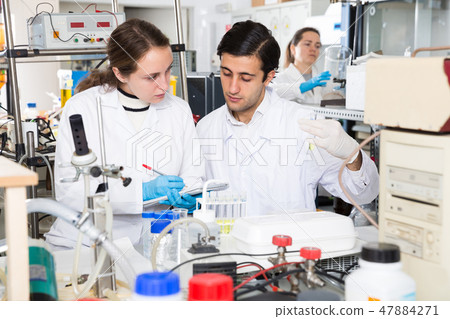 Students recording results of lab experiments Students recording results of lab experiments 47884271