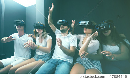 portrait of young people using vr glasses 47884346