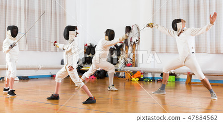 Mixed age group people at fencing workout 47884562