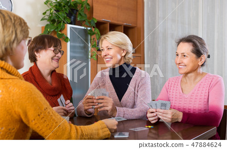 Female pensioners playing cards 47884624