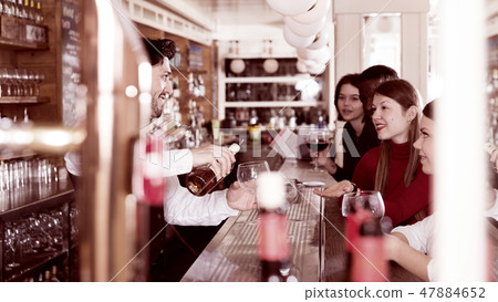 Young people on bar in restaurant 47884652