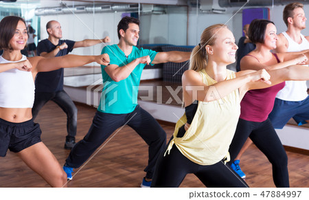 Men and ladies dancing zumba Men and ladies dancing zumba 47884997