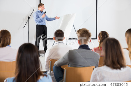 Male teacher lecturing to students Male teacher lecturing to students 47885045
