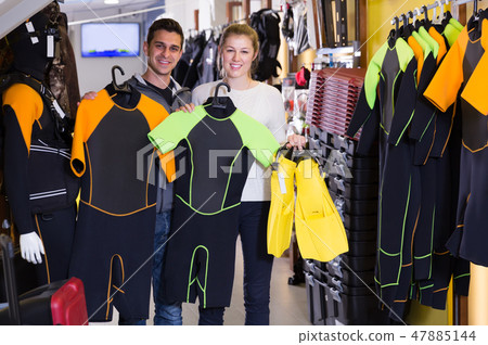 pair are satisfied of costumes for diving and flippers 47885144