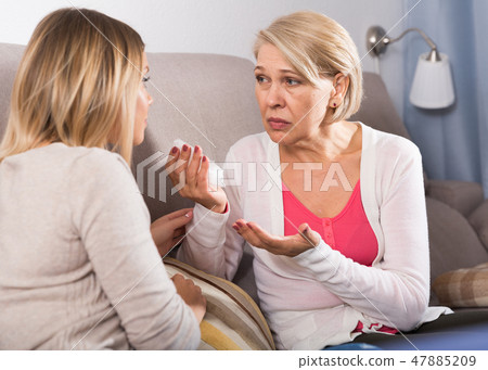 daughter comforts a sad mother daughter comforts a sad mother 47885209