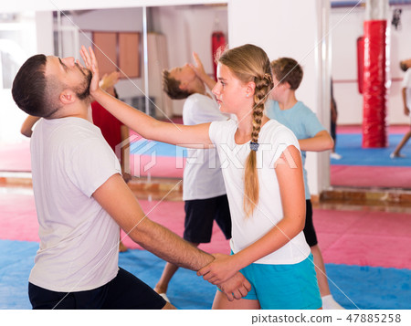 Kids exercising self-defense movements Kids exercising self-defense movements 47885258