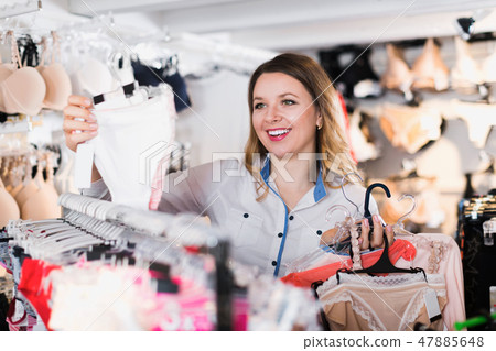 Happy woman customer choosing brassiere 47885648