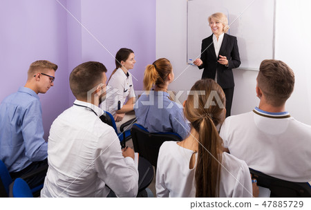 students attentively listening to lecture 47885729