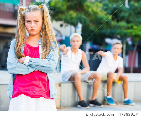 Offended girl after quarrel with friends Offended girl after quarrel with friends 47885917
