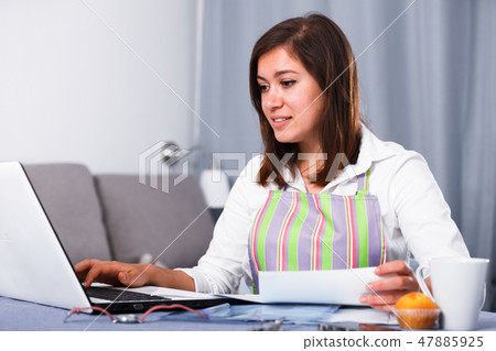Housewife searching for recipes 47885925
