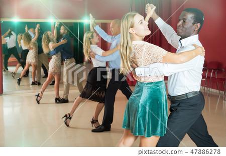 People dancing slow ballroom dances in pairs People dancing slow ballroom dances in pairs 47886278