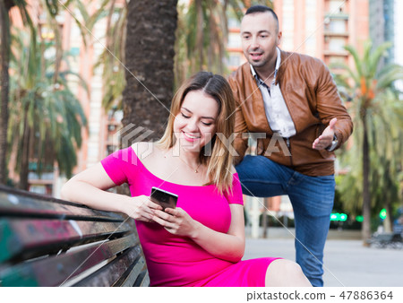 Girl is rejecting stranger man who wants acquintance with her Girl is rejecting stranger man who wants acquintance with her 47886364