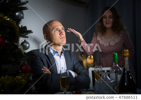 Couple quarreling at Christmas night 47886511