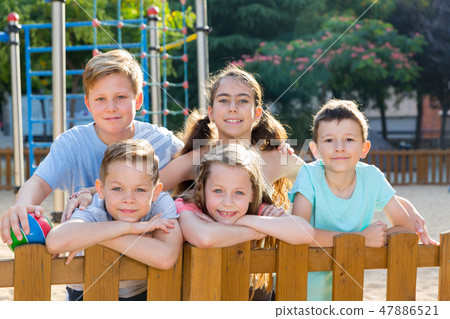 Cheerful kids posing at the playground Cheerful kids posing at the playground 47886521