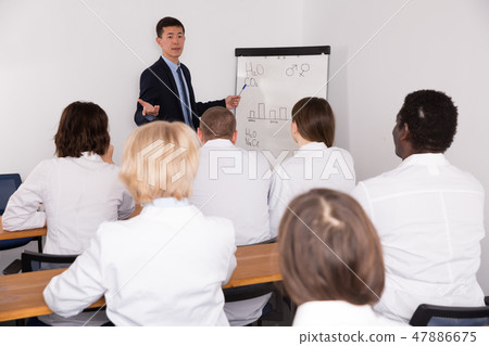 Korean male giving lecture at medical meeting Korean male giving lecture at medical meeting 47886675