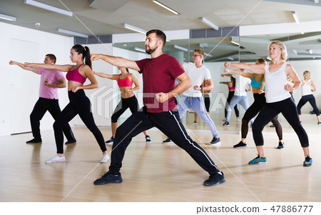 Group of active people practicing together 47886777