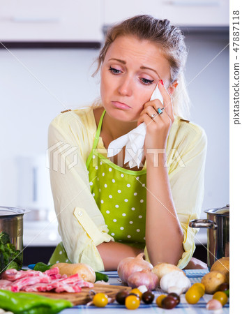 Frustrated girl looking at ingredients Frustrated girl looking at ingredients 47887118