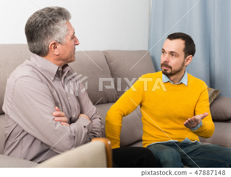 Adult father and son solve problems Adult father and son solve problems 47887148