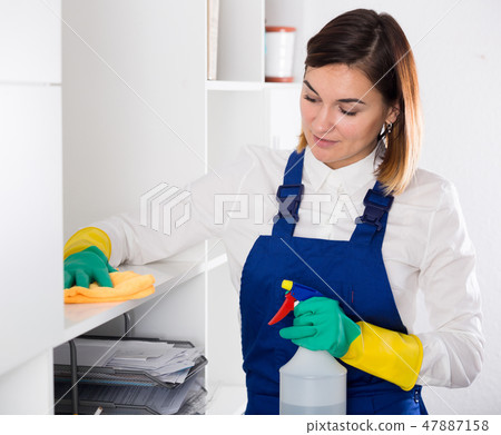 Female cleaner at work 47887158