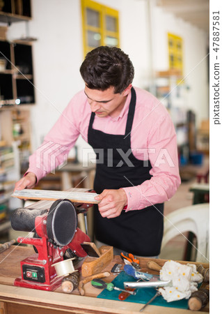 Joiner working on machine Joiner working on machine 47887581