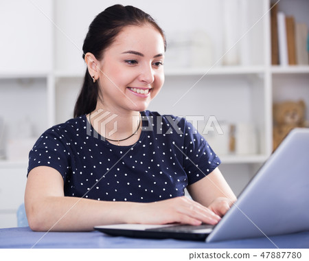 Attractive female on laptop 47887780