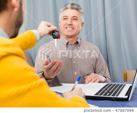 Mature and manager sign contract car lease 47887899