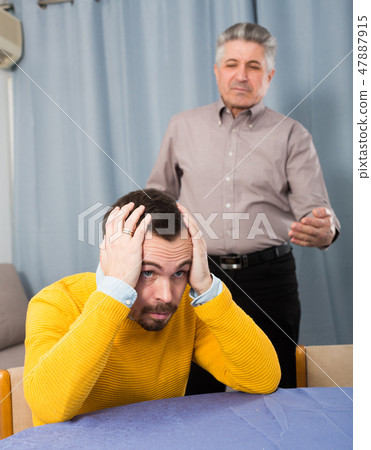 Adult father teaches his son Adult father teaches his son 47887915