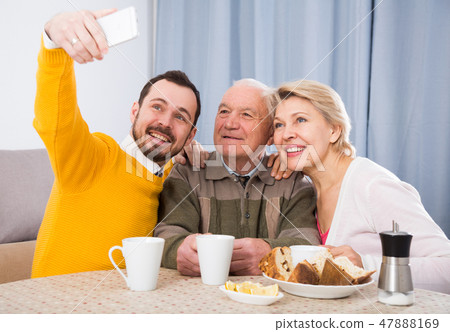 Family taking photos 47888169