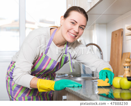 Female is caring about clean of kitchen Female is caring about clean of kitchen 47888230
