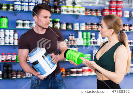 Active people discussing in shop interior 47888302