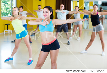 Positive men and women performing modern dance Positive men and women performing modern dance 47888554