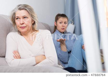 Adult daughter quarreled with her mother 47888764