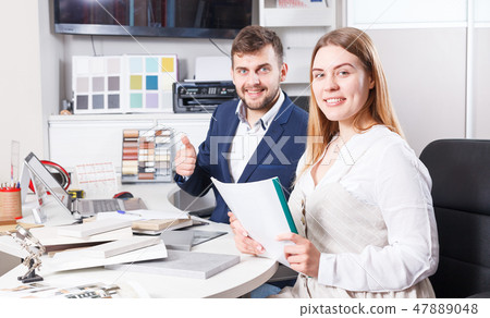 Girl getting quotation of furniture Girl getting quotation of furniture 47889048