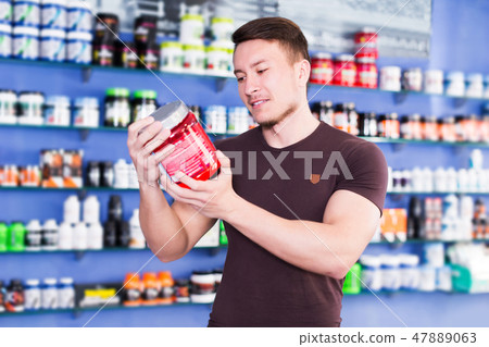 guy looking for necessary food supplements guy looking for necessary food supplements 47889063