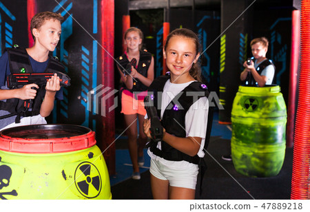 Girl during lasertag game 47889218