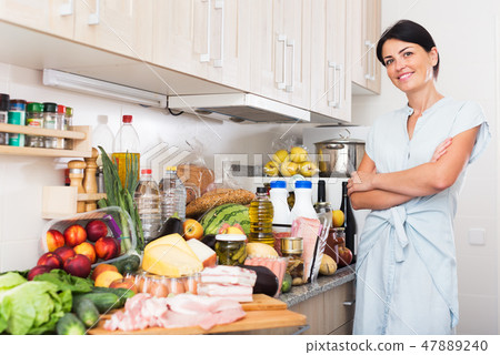 Portrait of woman in kitchen 47889240