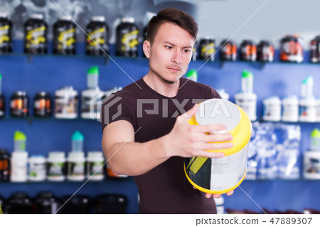 guy looking for necessary food supplements 47889307