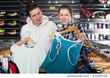 Happy tennis couple is looking on tennis T-shirt Happy tennis couple is looking on tennis T-shirt 47889558